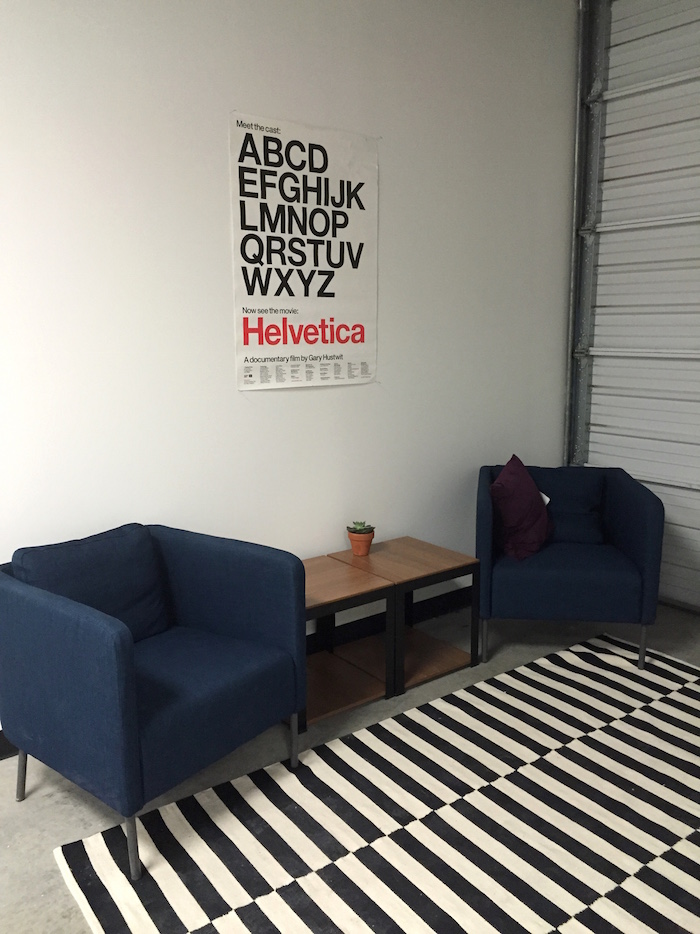 Helvetica posters and couches